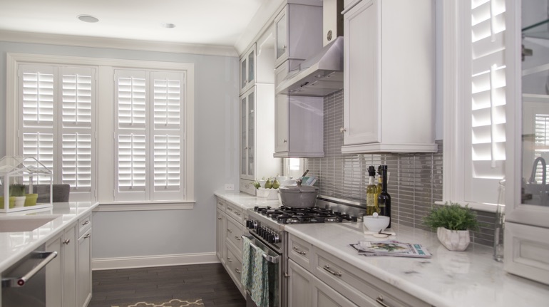 Polywood shutters in Denver kitchen with white cabinets.